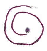 A ruby and diamond necklace, the graduated ruby beads with brilliant cut diamond set spacers, the