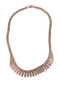 A 9 carat gold fringe necklace, the articulated necklace composed of graduating geometric brick