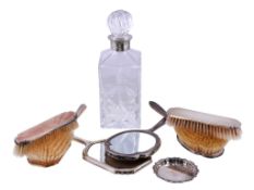 A three piece silver mounted and guilloche enamel dressing table set
