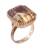 A 1970s citrine dress ring, the rectangular cut citrine with canted corners, in a multi claw