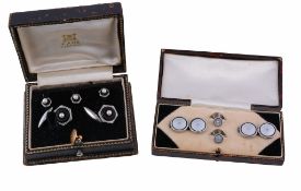 A pair of mother of pearl double sided cufflinks, the circular panels of mother of pearl within an
