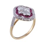 A diamond and ruby panel ring, centred with a quatrefoil of brilliant cut diamonds within a