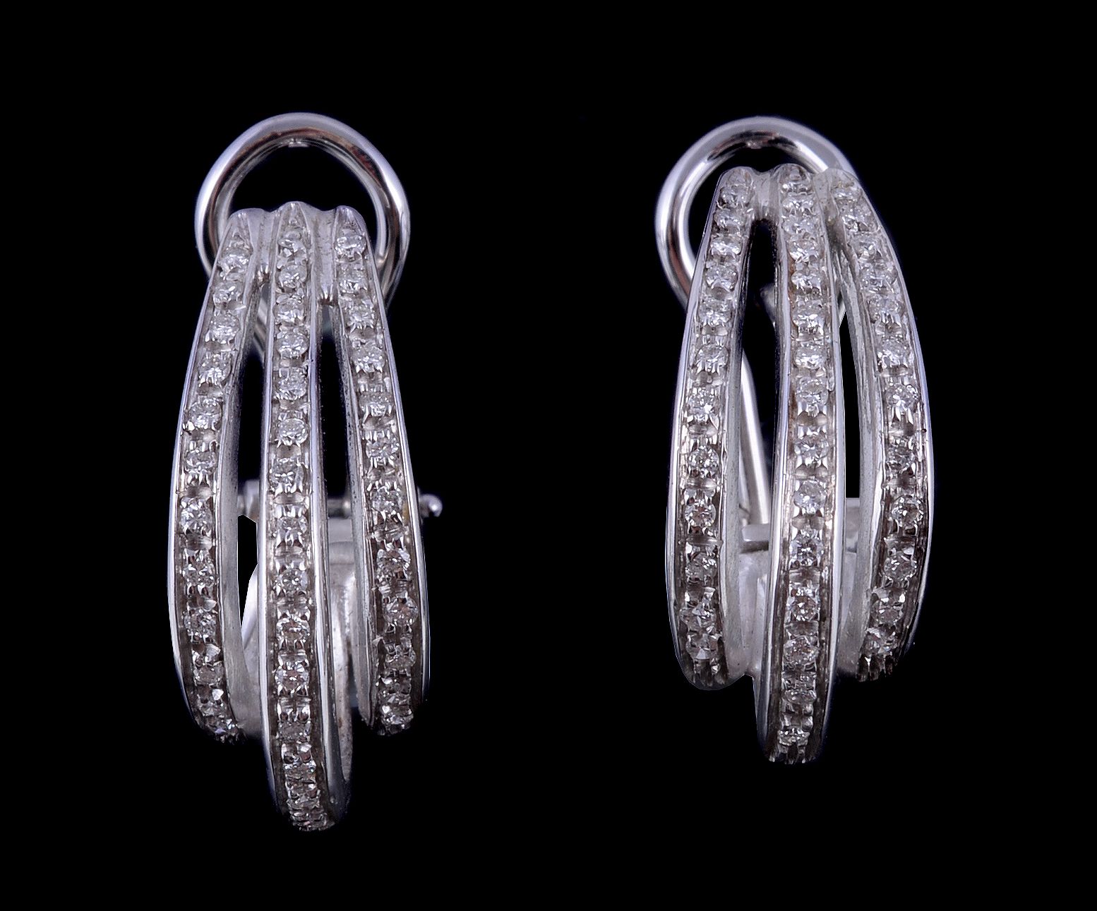 A pair of diamond ear hoops, the curved panels set with brilliant cut diamonds, approximately 0.80