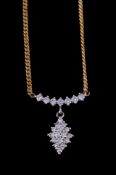 A 9 carat gold diamond pendant, the navette shaped pendant set with eight cut diamonds, suspended