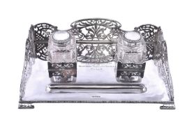 An Edwardian silver rectangular inkstand by James Dixon and Sons, Sheffield 1906, with a pierced