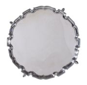 A silver shaped circular salver by Jay, Richard Attenborough Co. Ltd., London 1930, with a raised