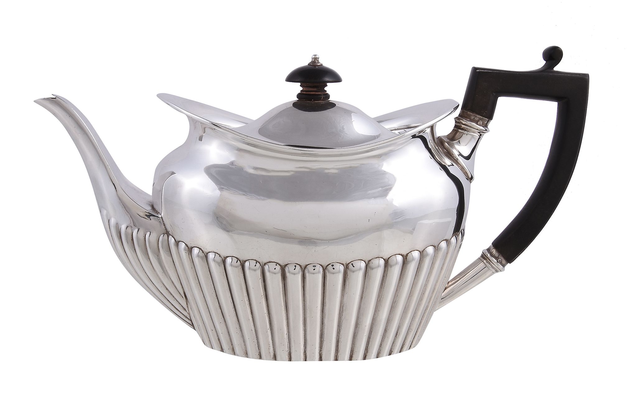 A late Victorian silver oval tea pot by W. & C. Sissons, London 1898, the half gadrooned body with