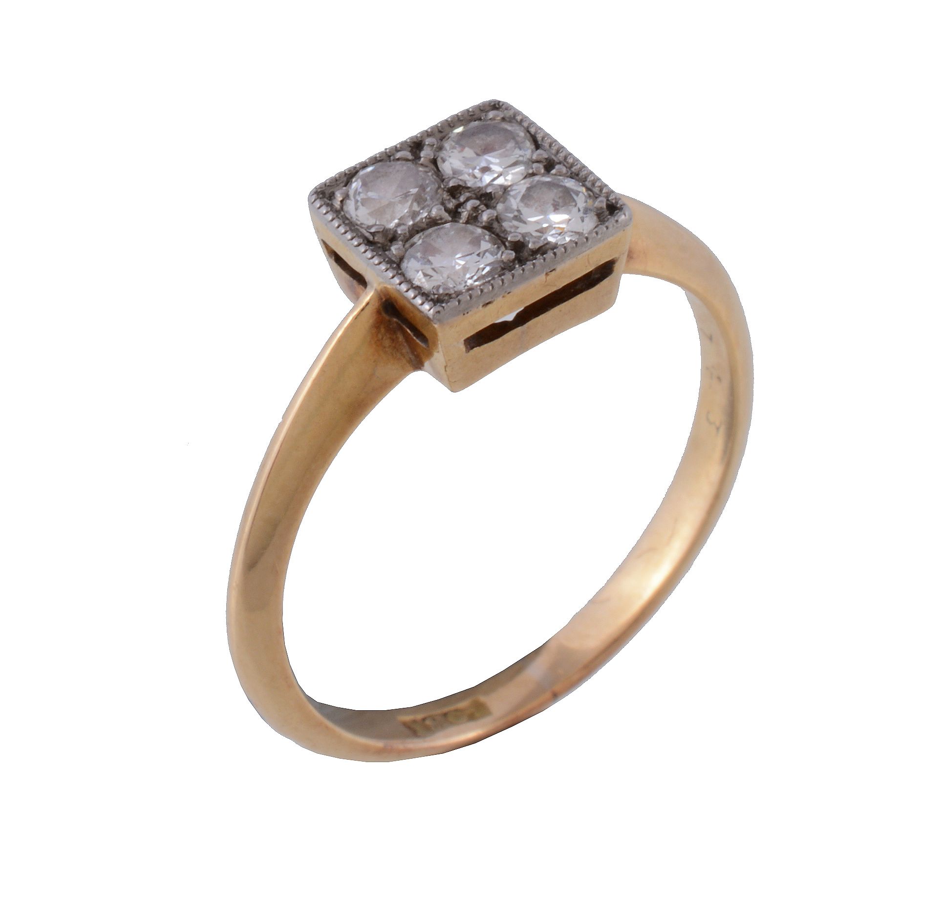 A 1920s four stone diamond ring , the old brilliant cut diamonds in a squared millegrained setting,