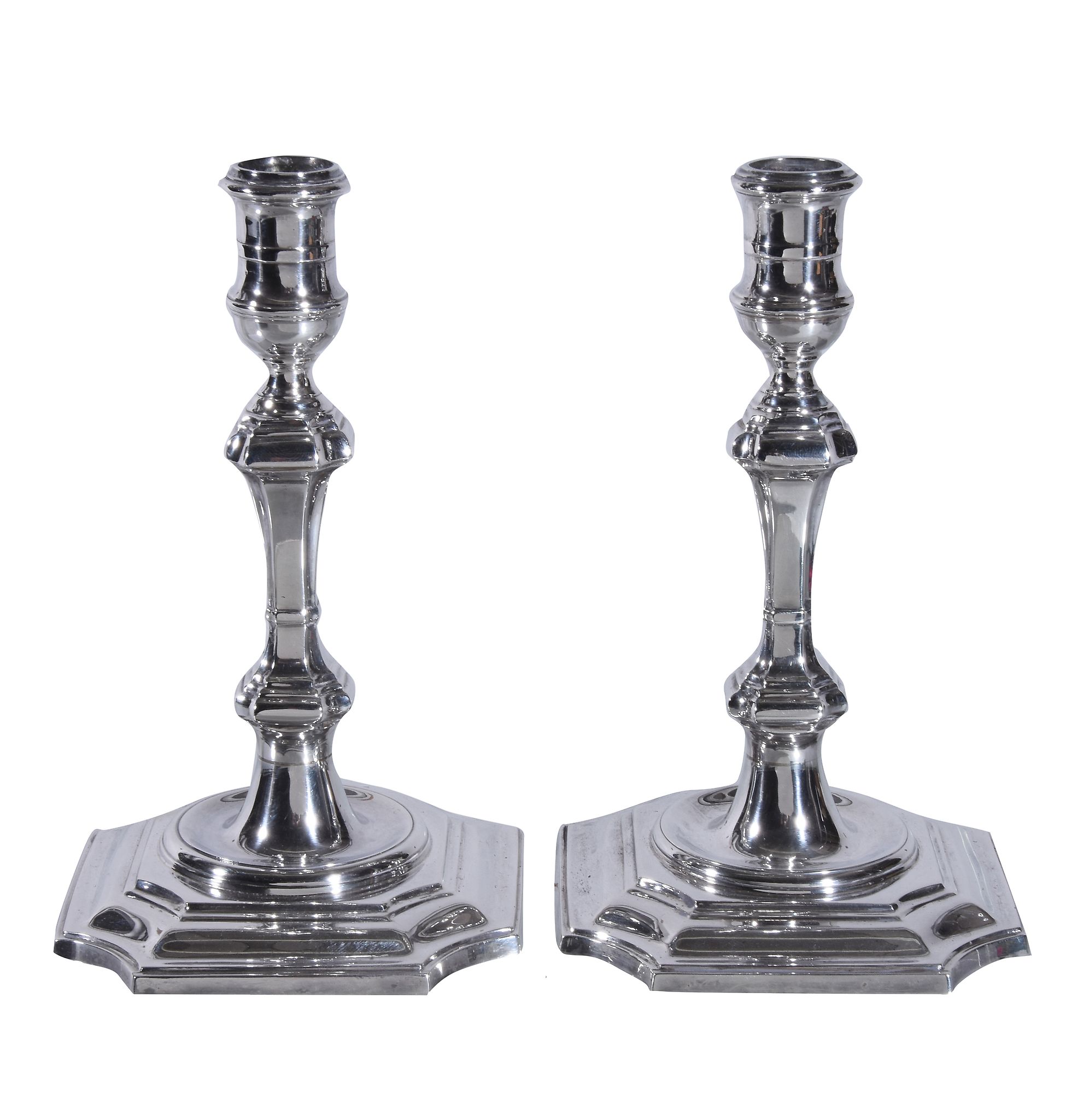 A pair of George I style silver candlesticks by Garrard and Co., Birmingham 1979, knopped stems and