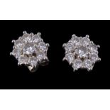 A pair of 18 carat gold diamond cluster ear studs, set with brilliant cut diamonds approximately 1.