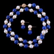 A lapis lazuli and freshwater cultured pearl necklace, set with alternating lapis lazuli beads and