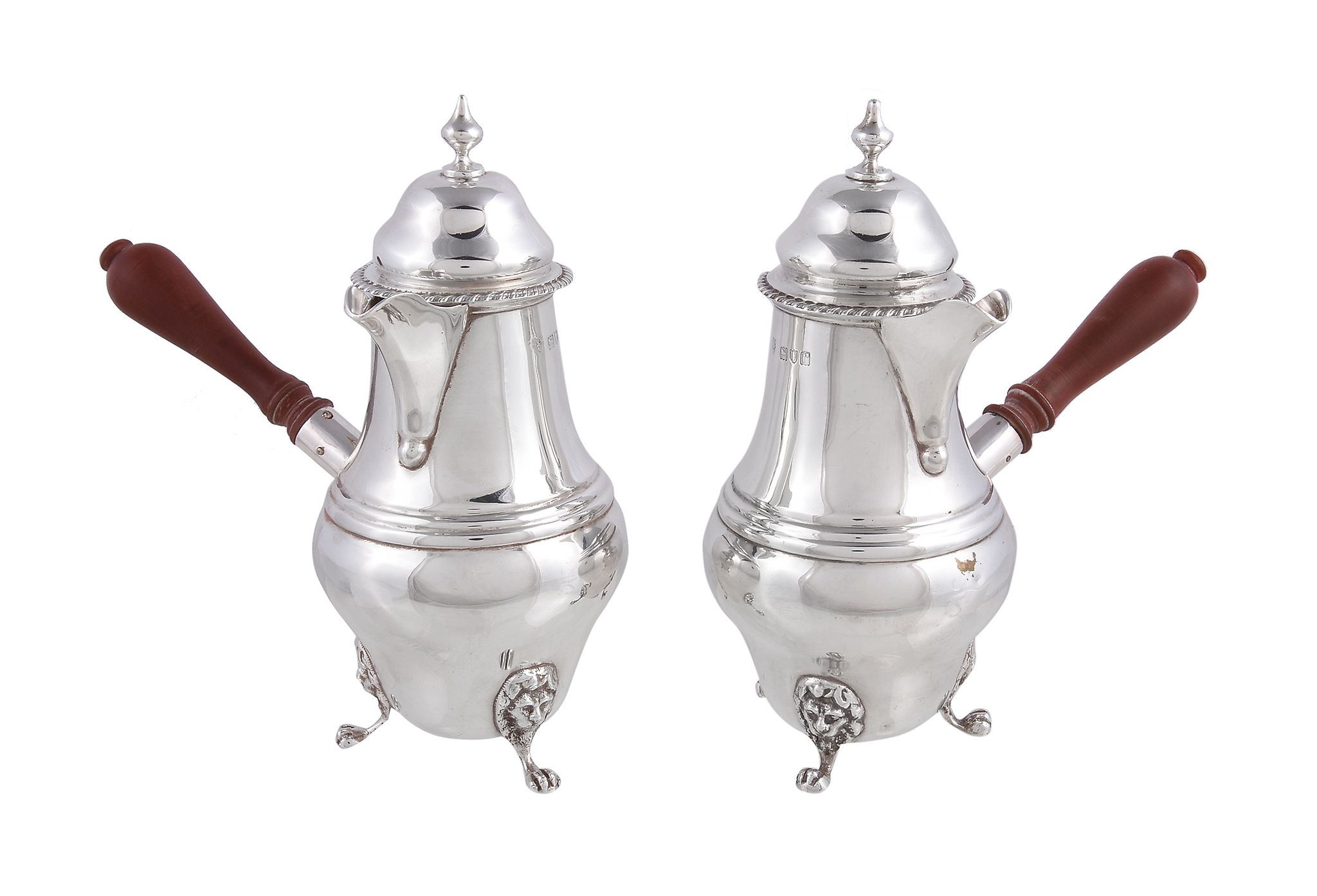 A pair of silver baluster cafe au lait pots by Charles Boyton & Son Ltd., London 1912, with