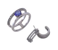 A tanzanite and diamond ring, the oval cut tanzanite on a double band shank, set with brilliant cut