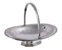 A Victorian silver oval swing handled pedestal basket by Elkington & Co. Ltd., Birmingham 1866,