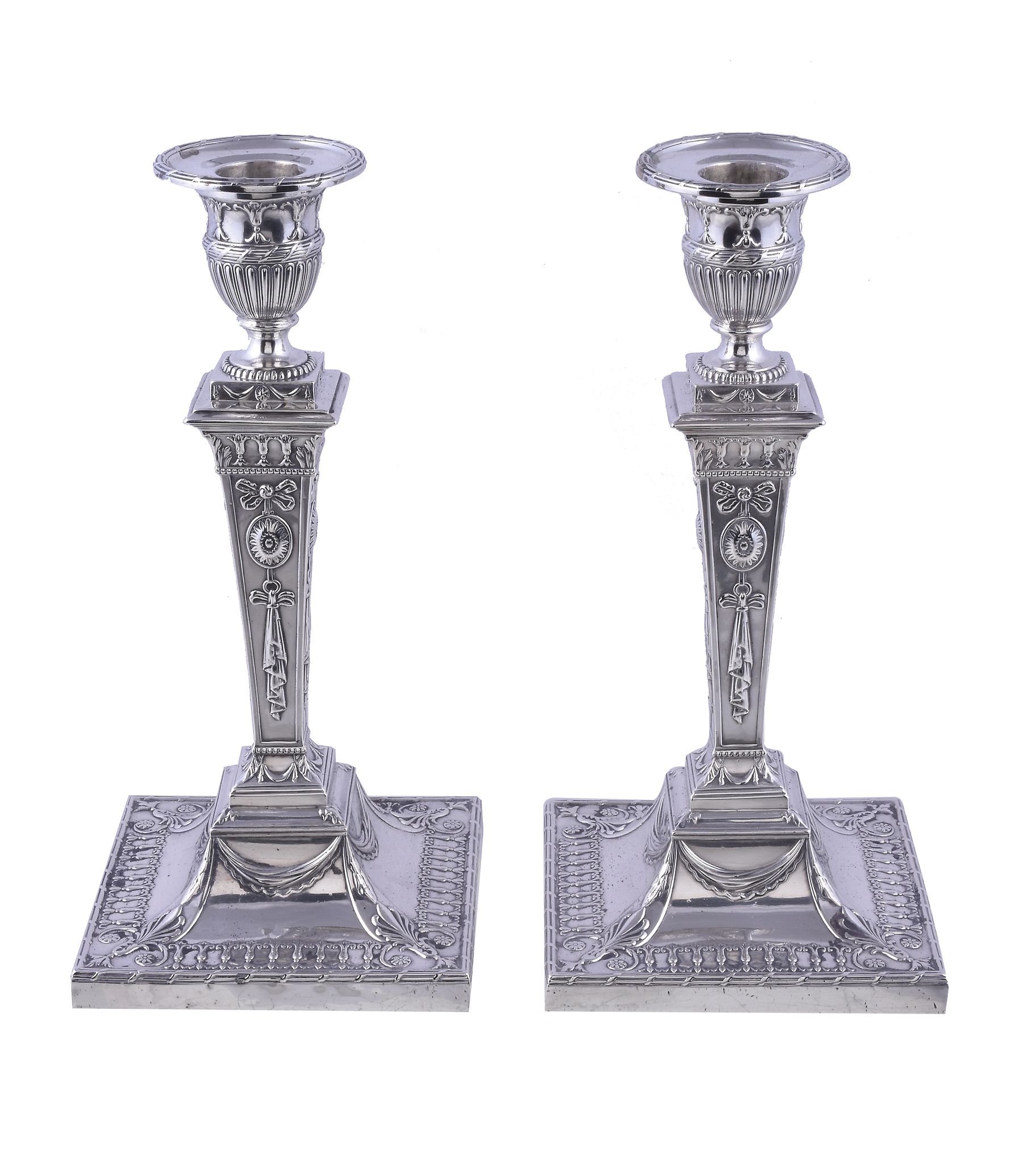 A pair of late Victorian silver neo-classical candlesticks by Thomas Bradbury & Sons, London 1898,