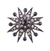 A late Victorian diamond and sapphire star brooch, circa 1890, the central circular cut sapphire