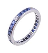 A sapphire and diamond eternity ring, the square cut sapphires and brilliant cut diamonds, finger