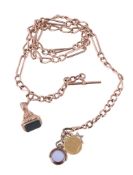 A 9 carat gold fancy curb link chain, 83cm long; suspending a 9 carat gold bloodstone seal; a 9