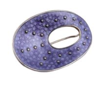 A purple enamelled brooch by Oystein Balle , Stavanger, Norway, circa 1960, the oval undulating