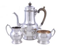 A silver three piece baluster coffee service by Garrard and Co. Ltd., London 1965 and 1966, the