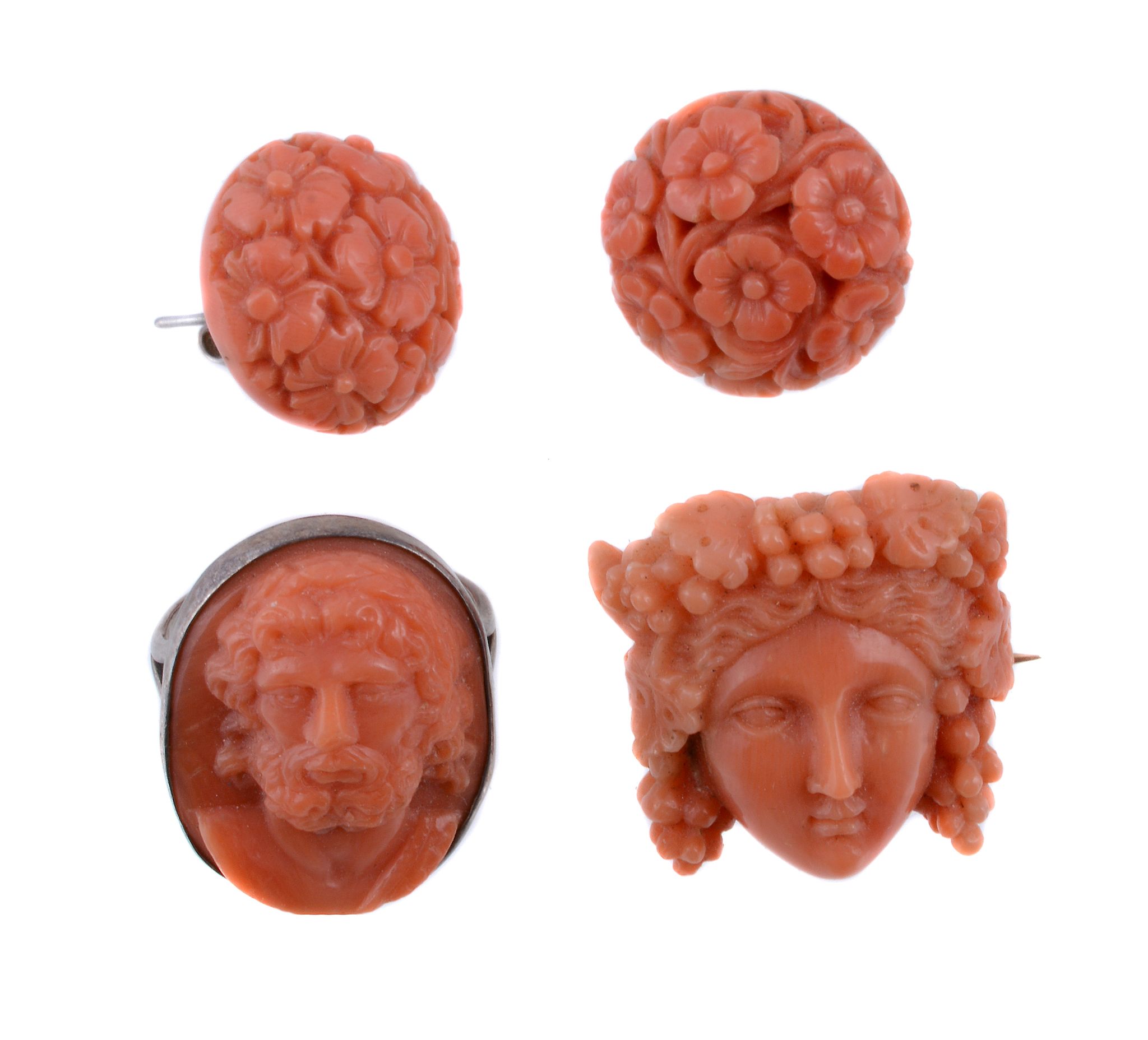 Ω A mid 19th century carved coral brooch,the brooch carved as Bacchus, with grape vines in his hair,