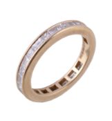 An 18 carat gold diamond eternity ring, set with alternating princess cut and baguette cut