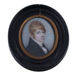 Ω English School, circa 1815 Portrait of a ginger haired young man Watercolour on ivory 6.3cm x 5.