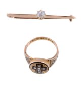 An Edwardian diamond bar brooch, the single old cut diamond estimated to weigh 0.33 carats, upon a