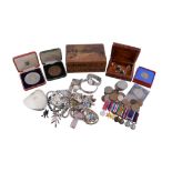 A collection of silver jewellery to include , an enamelled souvenir charm bracelet; a silver hinged