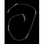A diamond set necklace, the belcher link chain set with trios of brilliant cut diamonds,
