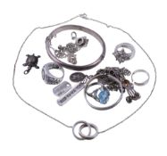 A small collection of silver coloured jewellery , to include a silver hinged bangle; various rings;