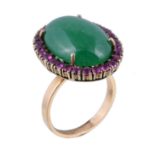 A stained agate and ruby ring, the oval cabochon stained green agate claw set within a surround of