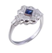 A diamond and sapphire cluster ring , the square French cut sapphire within a surround of brilliant
