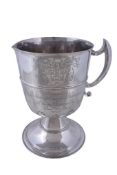 An Edwardian silver ewer by Elkington and Co., Birmingham 1906, with an angular handle, the body