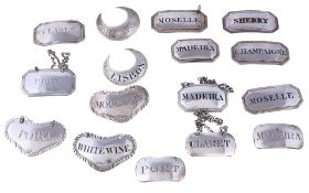 Sixteen various silver and plated wine labels, including: three early George III gadroon bordered,