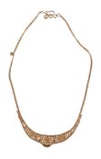 A 22 carat gold Indian necklace , the graduated beaded panel to a fancy link back chain, with