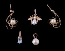 A pair of cultured pearl 9 carats gold earrings, the pierced gold flower panel each set with a