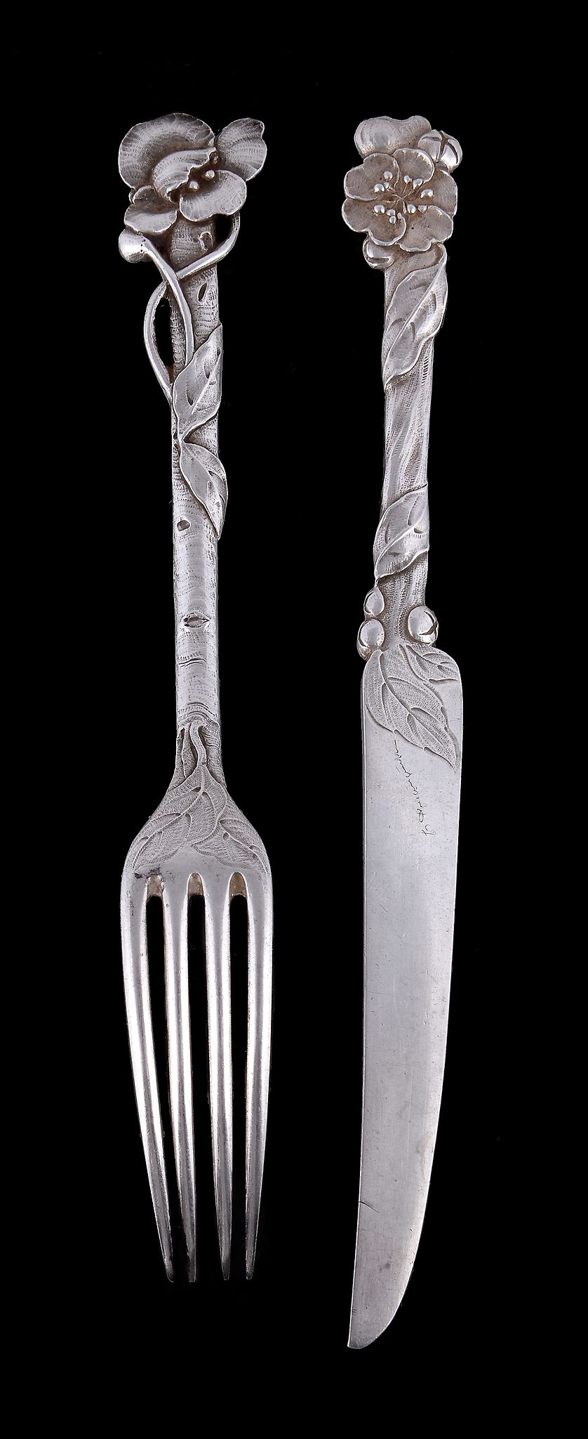 A set of twelve Art Nouveau silver fruit knives and one fork, unmarked, the knife blades with - Image 2 of 2