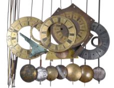 A quantity of clock dial fittings and longcase clock pendulum parts Various makers, late 17th
