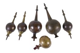 A group of six cast brass longcase clock finials Anonymous, late 17th / early 18th century