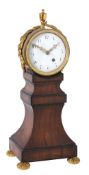 A Regency brass mounted satinwood balloon-shaped mantel timepiece with centre-seconds In the manner