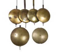 Four longcase clock pendulums Anonymous, late 18th century Each with lenticular bob three brass