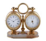 A French small gilt brass combination desk timepiece with aneroid barometer and thermometer