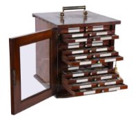 A Victorian mahogany microscope slide cabinet containing a collection of specimens The cabinet