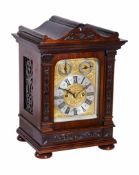 A small Victorian carved mahogany bracket clock Unsigned, last quarter of the 19th century The four