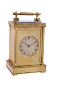 An English gilt brass carriage clock Unsigned, late 19th / early 20th century The four pillar