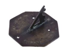 A small English patinated brass octagonal sundial Unsigned, possibly mid 17th century The 3.5 inch