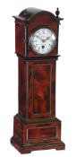 Ω A French brass mounted tortoiseshell mantel timepiece in the form of a miniature longcase clock