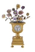 A fine French Empire small ormolu vase timepiece Unsigned, early 19th century The circular single