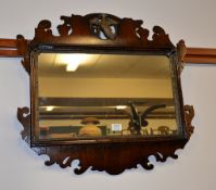 A fretwork mirror in George III style, with pierced ho-ho bird, 66cm high